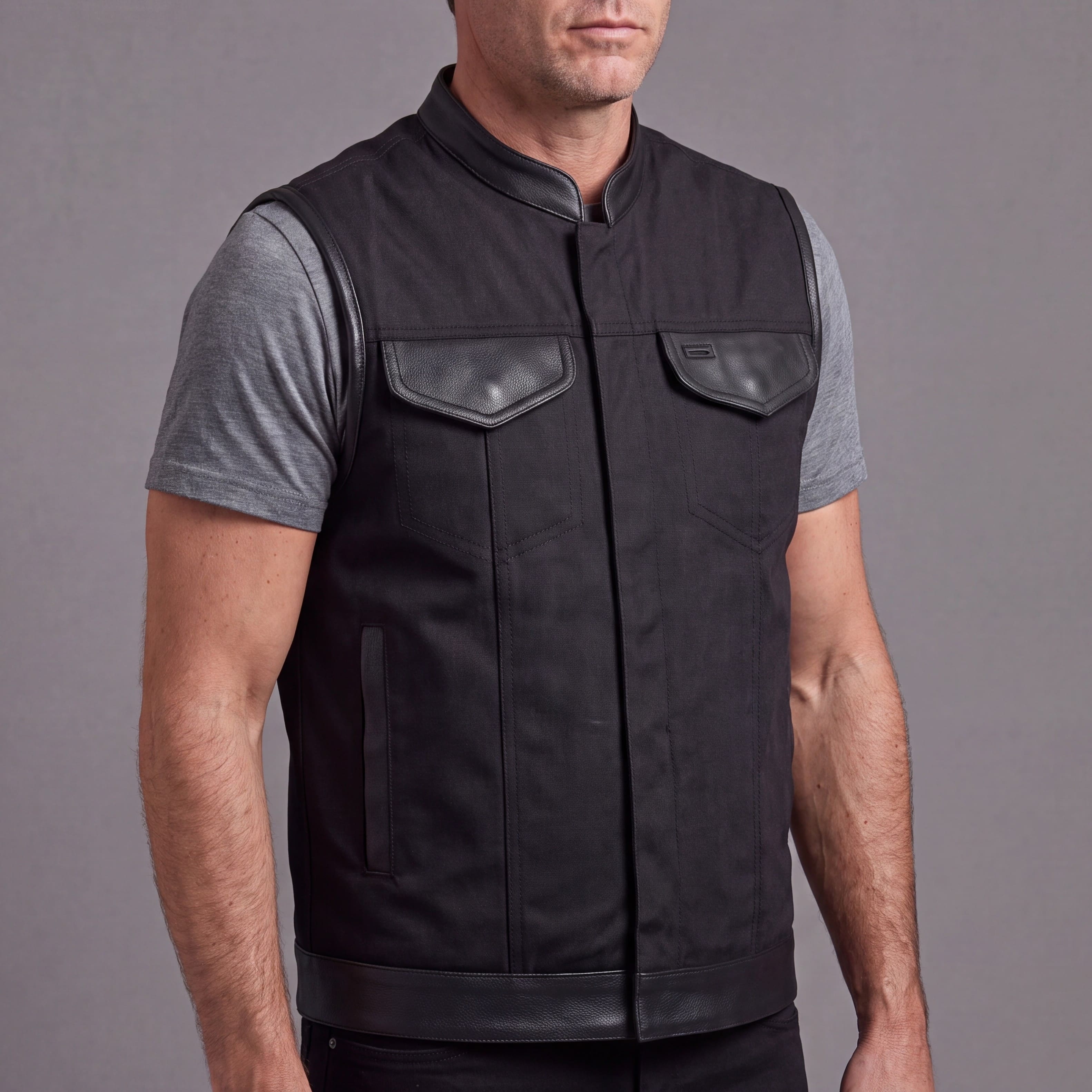 Vance Textile Mens Black SOA Club Style Leather Trimmed Textile Motorcycle Vest w/ Front Zipper and Snap Closure - side pose